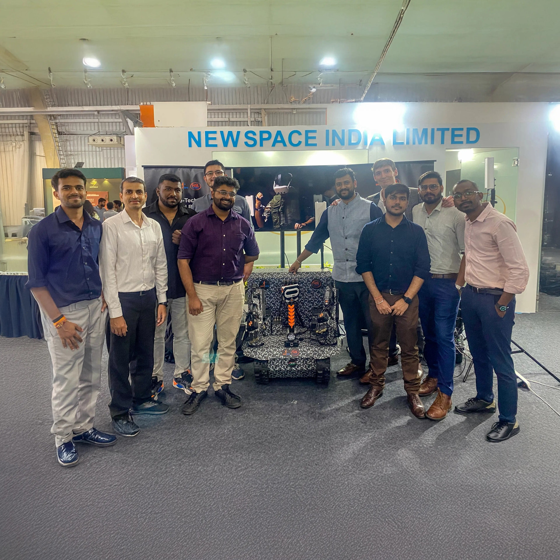 Integra Robotics team working on industrial robots
